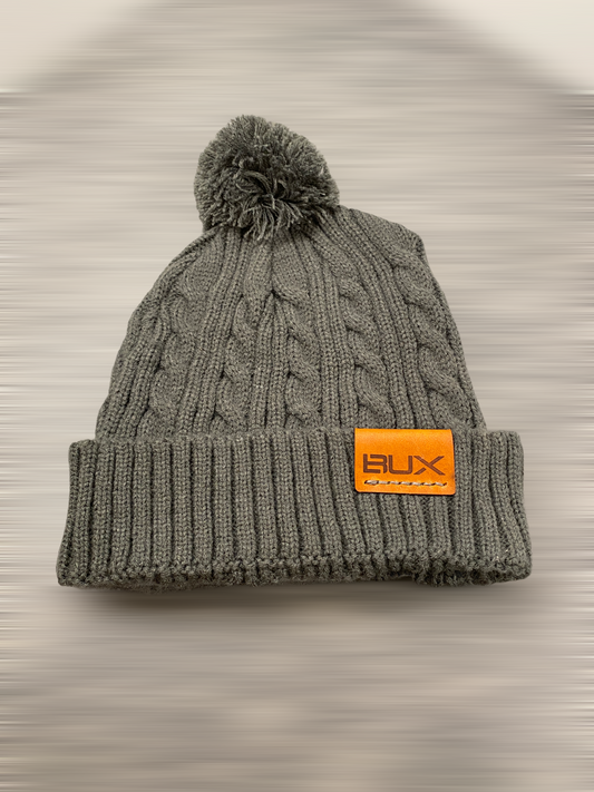 cable knit beanie with pom pom and cuff